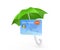 Credit card under green umbrella.