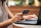 Credit card, woman hands and laptop at cafe for ecommerce payment, fintech money or online shopping. Closeup customer