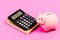 Credit concept. Calculate profit. Piggy bank pink pig and calculator. Finance manager job position. Economics and