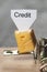 Credit sign on a cheese in mouse trap