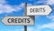 Credits and debits as a choice - pictured as words Credits, debits on road signs to show that when a person makes decision he can