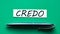 CREDO - word on a green background with a black handle