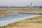 Creek, geese, reeds, grass and church tower