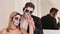 Creepy couple of actors with scary Halloween makeup in vintage costumes.