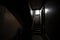 creepy and dark stairwell, with only a sliver of light visible from the exit