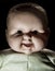 Creepy doll face. It seems like character of horror movie. Angry baby doll, fear of living ghost. Halloween concept. Low-key