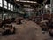 A creepy forgotten factory floor with broken machines.