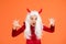 Creepy girl wear devil horns having long white hair wig creating halloween mood, halloween all saints