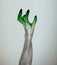 Creepy Halloween monster witch hand with white, green and black