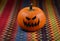 Creepy Halloween Pumpkin on a multicolored background stock images