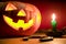 Creepy pumpkin near candle, halloween concept