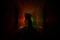 Creepy silhouette in the dark abandoned building. Dark corridor with cabinet doors and lights with silhouette of spooky horror per