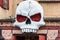 Creepy skull above the entrance of a haunted house