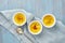 Crema catalana, Spanish dessert in three ramekin on blue table, copy space, top view