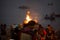 Cremation ceremony in Manikarnika Ghat on the Ganges River in Varanasi, People look at the funeral pyre