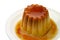 Creme caramel in a dish closeu