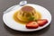 Creme caramel vanilla custard dessert or flan on white dish with