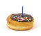 Creme filled donut with birthday candle on top