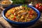 Creole jambalaya with rice, chicken meat, sausages and vegetables on wooden background
