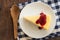 Crepe cake and coffee with teapot on wood table.