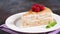 Crepe cake with pastry cream on white plate