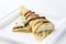 Crepe cone with whipped cream, banana and chocolate sauce