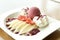 Crepe with raspberry ice cream and whipped cream