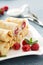 Crepes filled with cottage cheese and raspberry