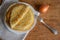 Crepes (Russian Blini) with onion on wooden background, top view. Homemade thin fresh crepes for breakfast