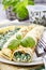 Crepes stuffed with cheese and spinach