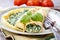 Crepes stuffed with cheese and spinach