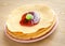 Crepes under cherry topping