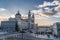 Crepuscular rays or Sunbaems sunset view of Madrid Cathedral Santa Maria la Real de La Almudena in Madrid, Spain.