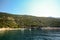 Cres Island, Istria Croatia: View from the water to the beach and sailing boat at adriatic sea near village Valun