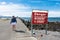 CRESCENT CITY CA: Despite the warning on the sign not to walk on the jetty, a female tourist ignores the sign,