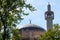 Crescent, dome and minaret of the London Central Mosque, part of the Islamic Cultural Centre, Regent`s Park, London UK