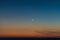 Crescent moon above the last sunlight of the day