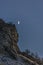 Crescent moon hangs over valley walls in Utah