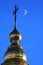 Crescent moon near the cross on top of St. Michael`s Golden-Domed Monastery in Kyiv, Ukraine