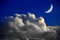 Crescent Moon and Thunder Clouds in Stark Blue Sky