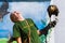 Crested caracara on hand of a trainer in a bird show