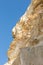 Cretaceous rock by the sea with a view of the blue sky