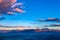 Cretan seascape at sunset with mountains, moon and clouds. Crete, Greece