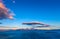 Cretan seascape at sunset with mountains, moon and clouds. Crete, Greece