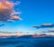 Cretan seascape at sunset with mountains, moon and clouds. Crete, Greece