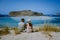 Crete Greece, Balos lagoon on Crete island, Greece. Tourists relax and bath in crystal clear water of Balos beach.