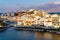 CRETE, GREECE - JULY 10 2023: The lake and harbour area of the town of Agios Nikolaos at sunset (Lasithi, Crete, Greece