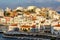 CRETE, GREECE - JULY 10 2023: The lake and harbour area of the town of Agios Nikolaos at sunset (Lasithi, Crete, Greece