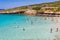 CRETE, GREECE - JULY 12 2023: Swimmers enjoying the warm, crystal clear waters around Kolokitha, near Elounda in Lasithi, Crete