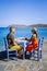 Crete Greece Plaka Lassithi with is traditional blue table and chairs and the beach in Crete Greece. Paralia Plakas